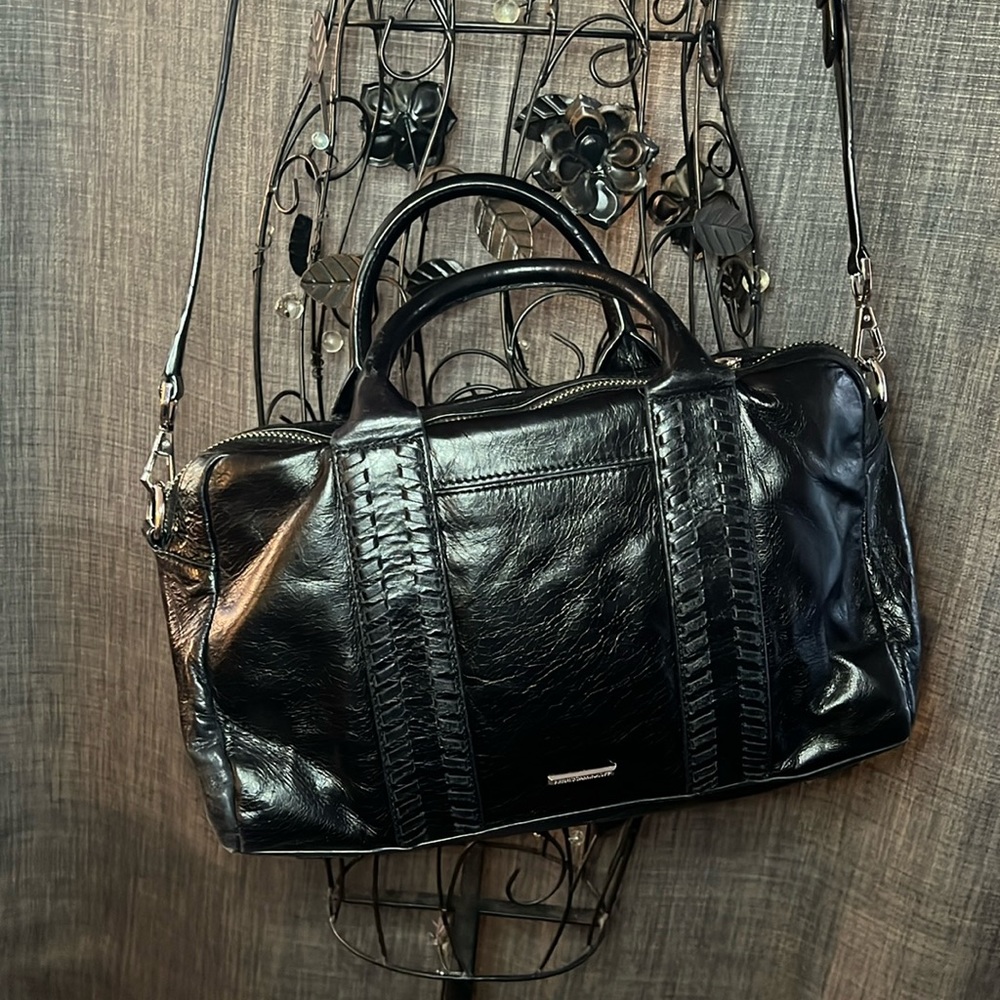 Rebbeca Minkoff 14W x 8H cross body purse. Color is black with silver zippers.